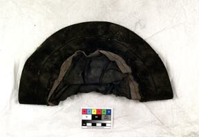 Image of a late 19th/early 20th century hat found in Cupar, Fife with a single leather glove. The hat was found folded in half. It now belongs to the Karen Finch Reference Collection housed at the Textile Conservation Centre